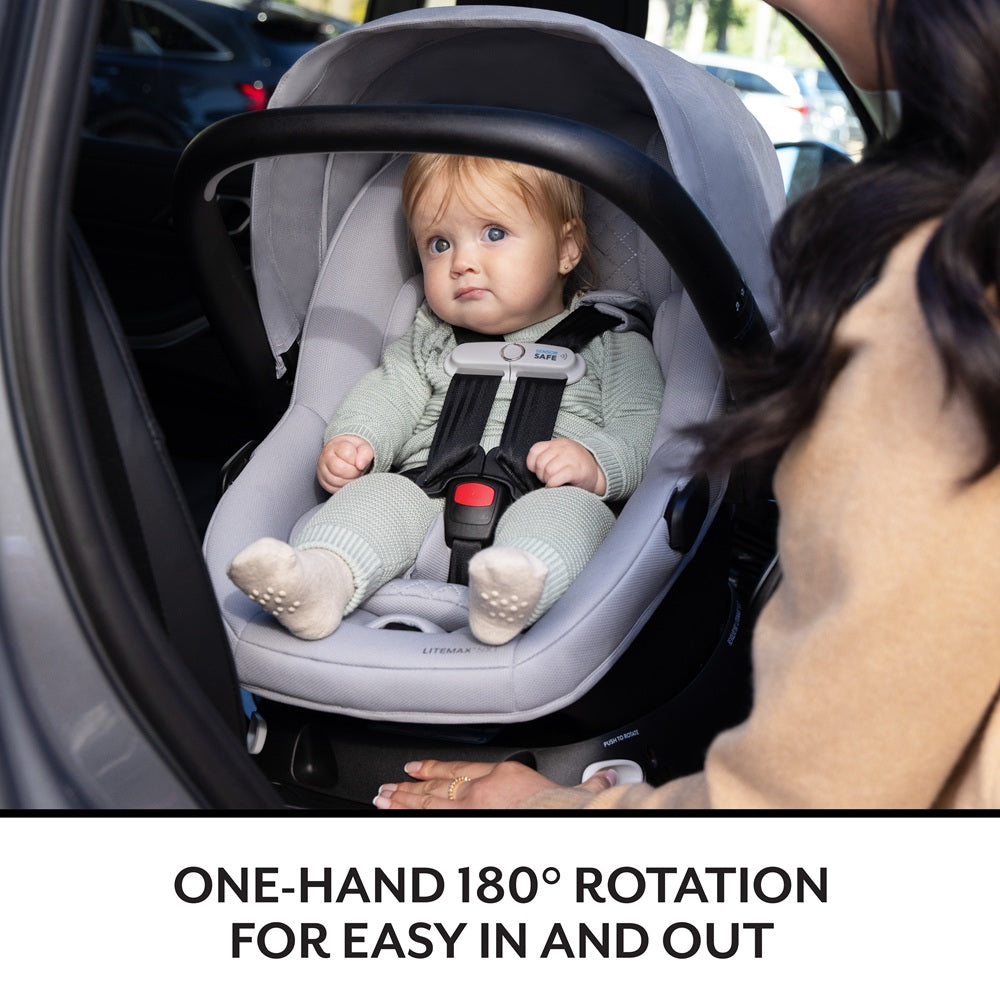 Infant car seat Evenflo Revolve180 Litemax NXT with Sensorysoothe, gray, installed in car.