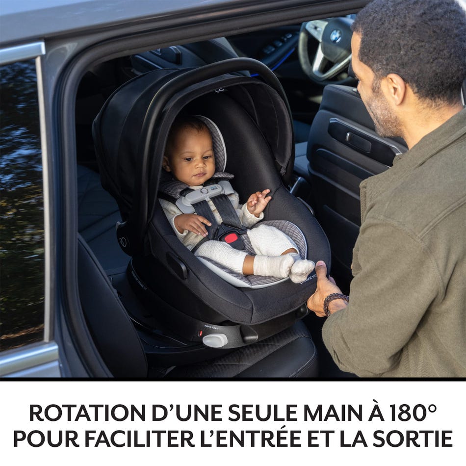 Evenflo Revolve180 Litemax NXT infant car seat in black fabric installed in car with parent fastening harness
