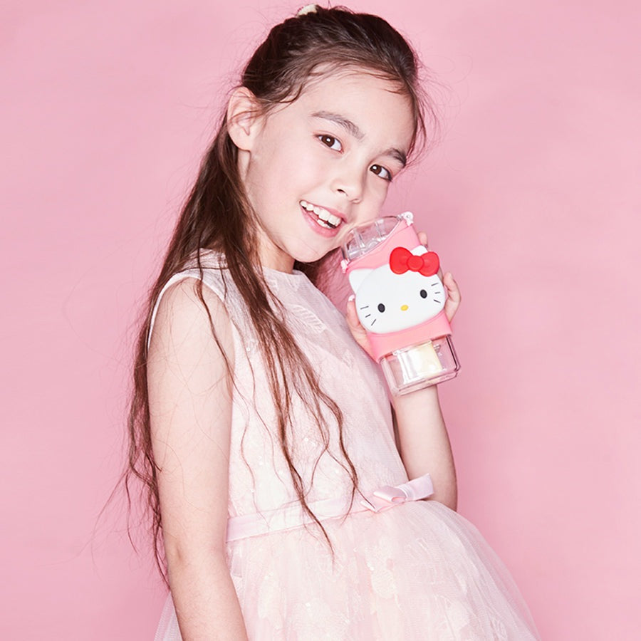 FamilyOut Hello Kitty ice pop water bottle, pink with clear base, held by a girl in a pink dress