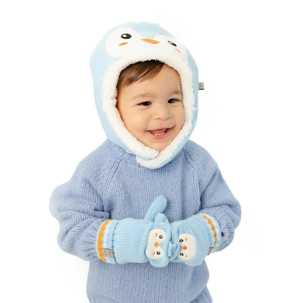 FLAPJACKKIDS Knitted Fingerless Gloves W/Flap Penguin worn by a smiling baby with hands clasped to show the penguin flaps.