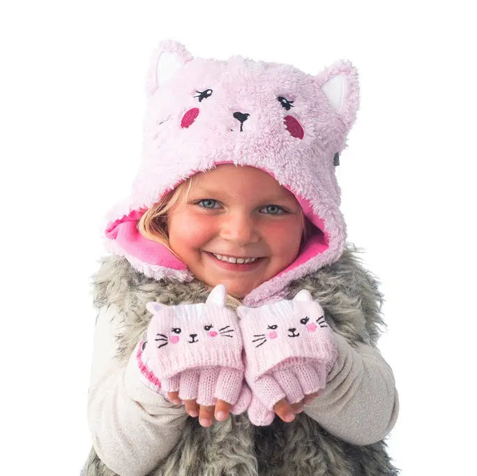 Flapjackkids Reversible Kids Sherpa Hat Cat & Superhero in pink, worn by smiling child with matching pink cat mittens.