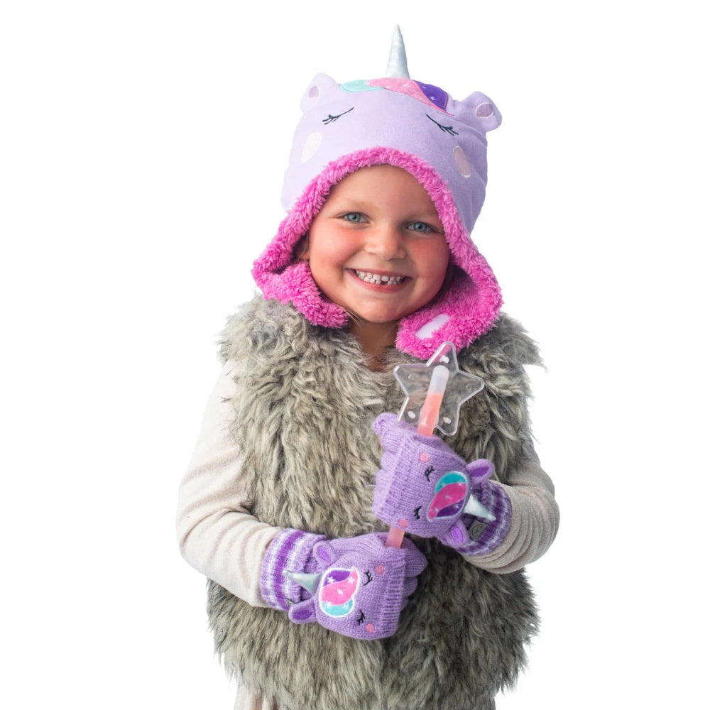 Flapjackkids reversible sherpa hat unicorn narwhal design in lavender with pink trim on a smiling child