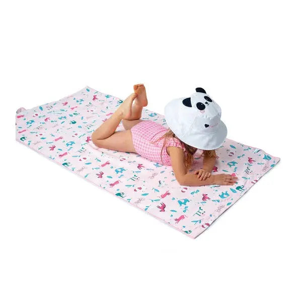 Flapjackkids Reversible Kids Sun Hat Panda & Koala, worn by a child lying on a pink animal-print mat.