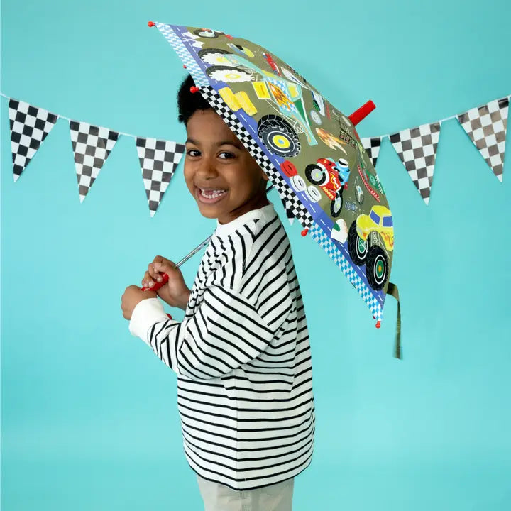 Floss and Rock Colour Changing Umbrella Cars held by a smiling child in a striped shirt, car design visible.
