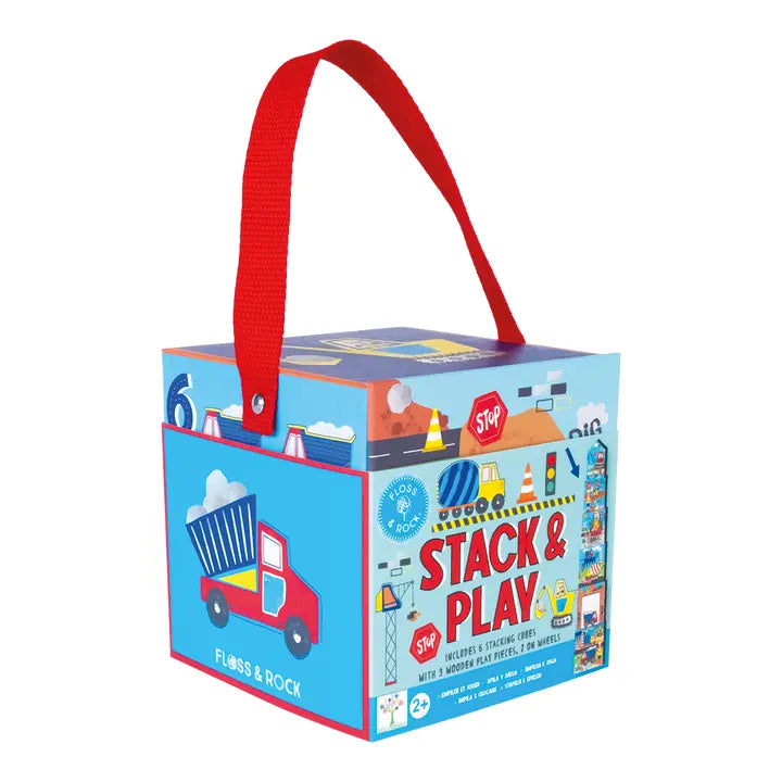 Floss and Rock Stacking Cubes box with red carry handle, blue panels, and a playful truck illustration.