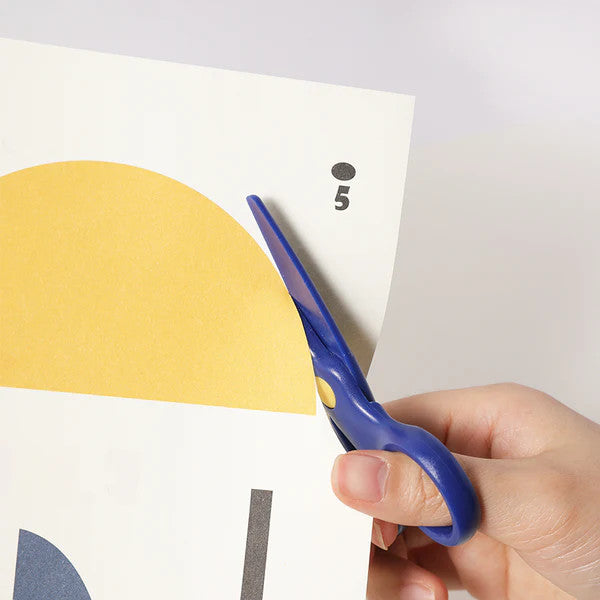 Flower Monaco kid's plastic scissors with blue handles cutting yellow paper