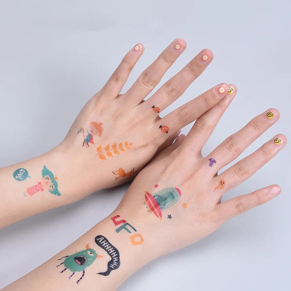 Flower Monaco washable temporary tattoos on hands featuring Viking designs and matching nail art