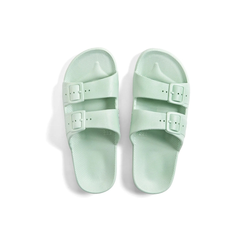 Freedom Moses Basic Sage sandals in mint green with two buckle straps shown laid flat.