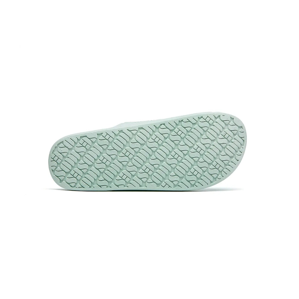 Freedom Moses Basic Sage slipper sole laid flat, mint-green with textured tread for grip.