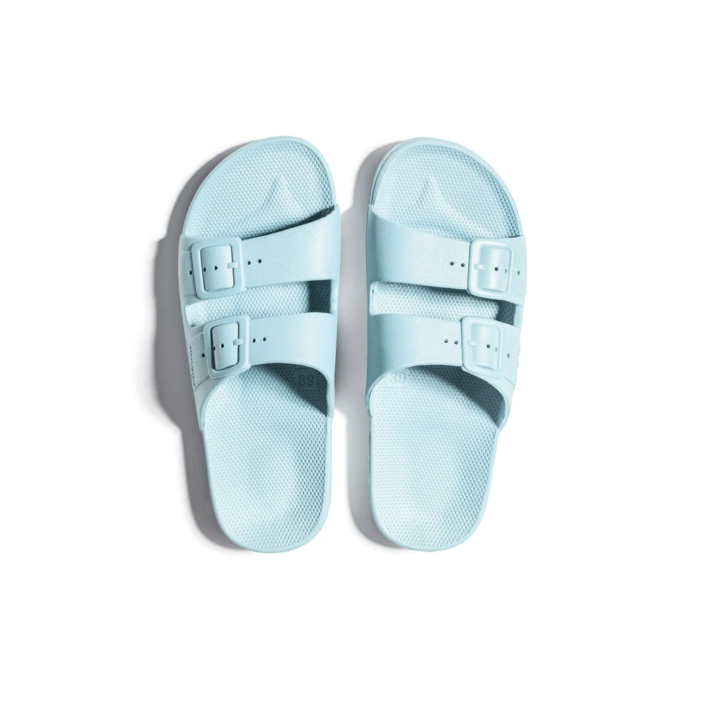 Freedom Moses Prints Adult Virgin sandals in light blue, two-buckle straps, shown as a pair.