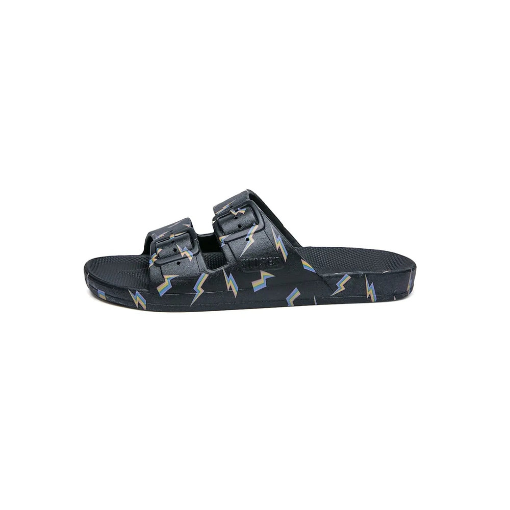 Freedom Moses Prints Bolt Black slide sandal with multicolor bolts, displayed on a neutral surface.