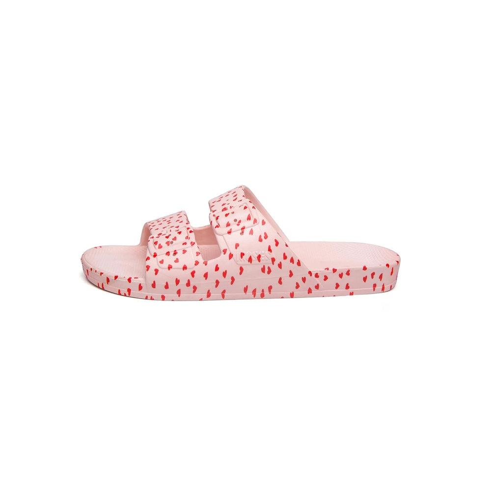 Freedom Moses Prints Love 2.0 Rosa pink heart-pattern slide sandals with twin straps.