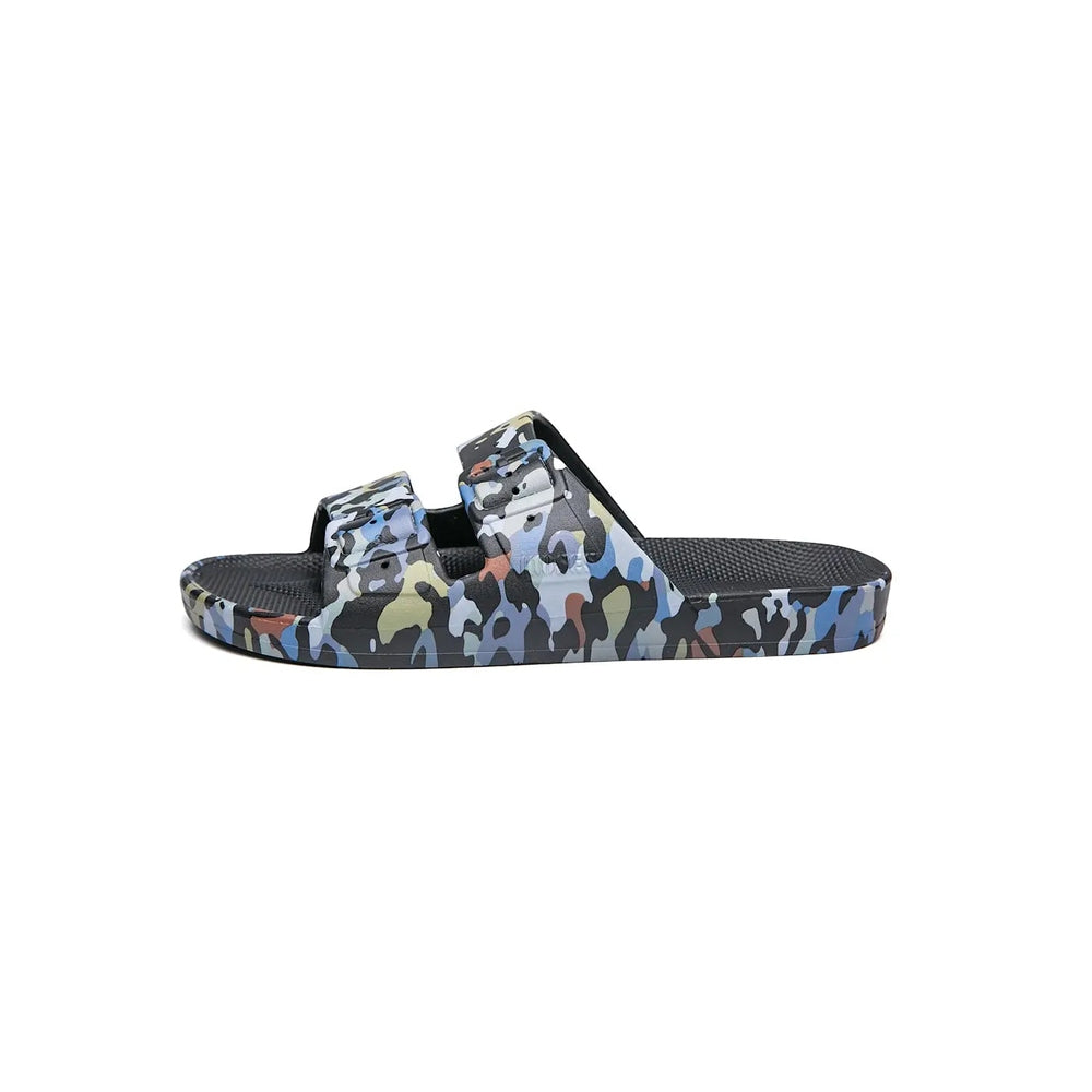 Freedom Moses Prints Mercury Black slides in blue camouflage, showing dual-strap design and textured footbed.