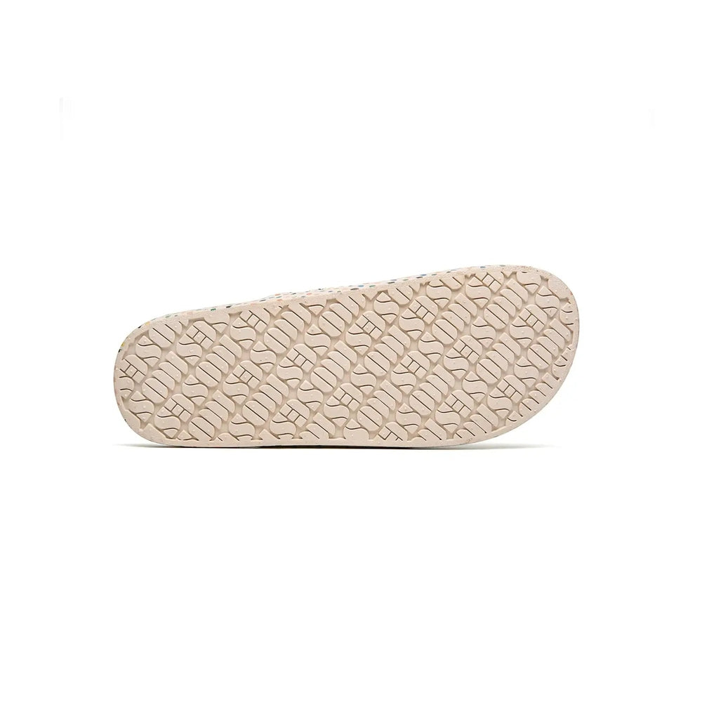 Freedom Moses Prints Retro Dots slippers with beige rubber sole and textured tread showing grip.