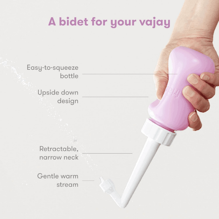 Frida Mom Upside Down Peri Bottle in pink with easy-to-squeeze design, retractable neck and gentle stream.