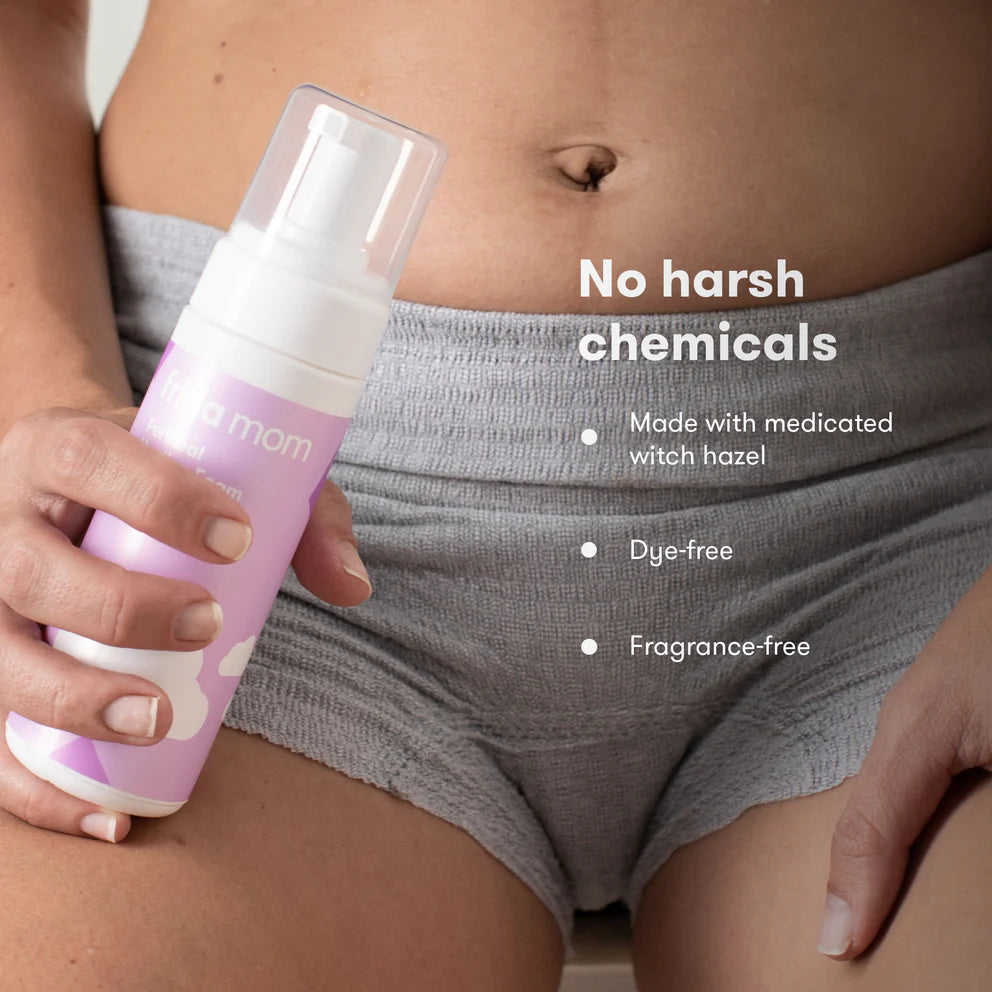 Frida Mom Witch Hazel Perineal Healing Foam bottle in pastel purple with spray cap; fragrance-free