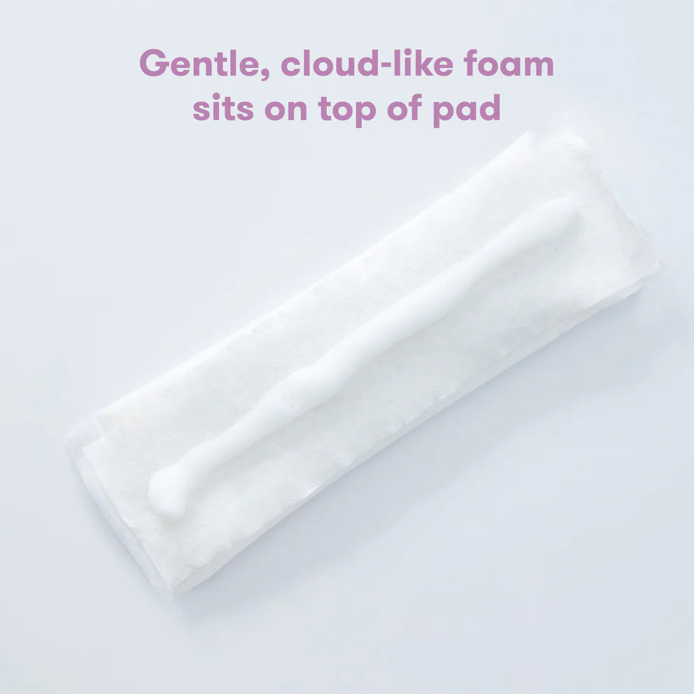 Frida Mom Witch Hazel Perineal Healing Foam on white pad, soothing postpartum perineal care