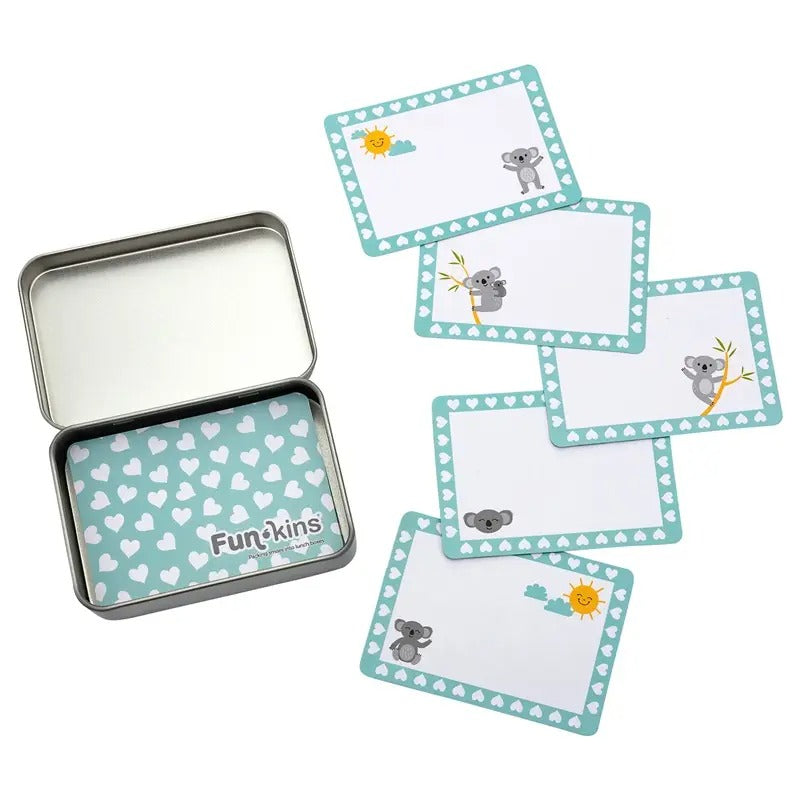 Funkins Lunchbox Note Cards in Teal with white heart border and koala illustrations, shown with a matching metal lunchbox.