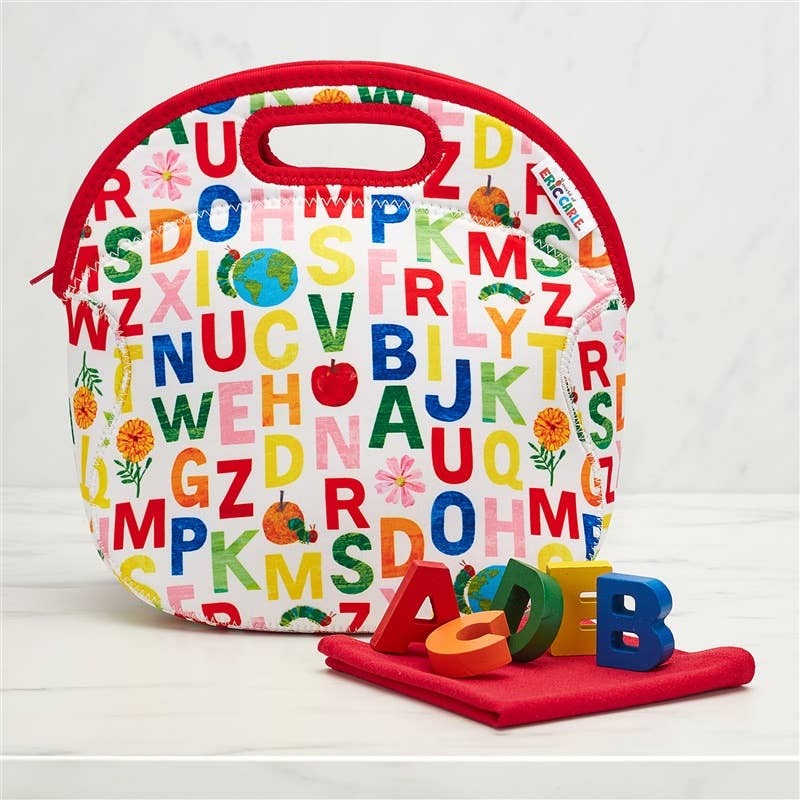 Fabric lunch bag with red zipper and handle, white canvas with multicolor alphabet print and flowers.