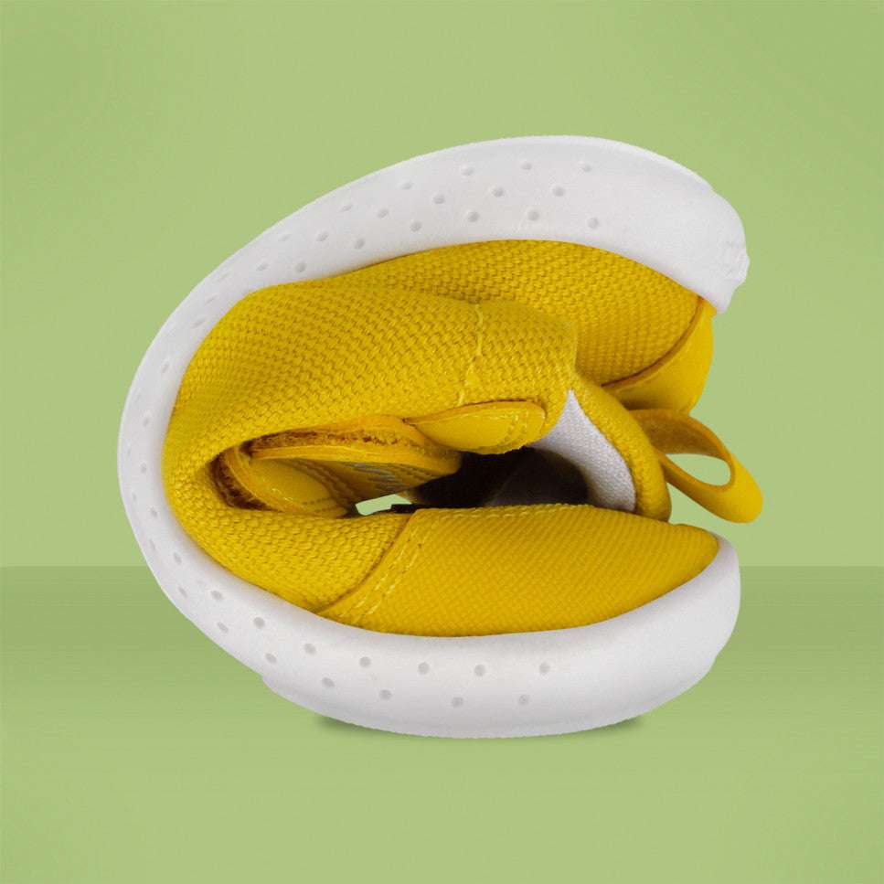 Garvalin barefoot children's canvas sneakers in yellow with white sole