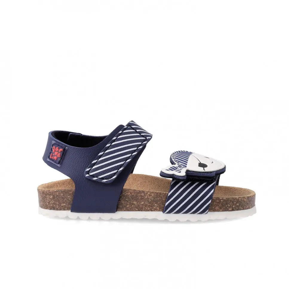 Garvalin Bio Sandals For Childrens Azul Marino: navy sandal with striped navy/white straps fastened by Velcro over cork footbed.