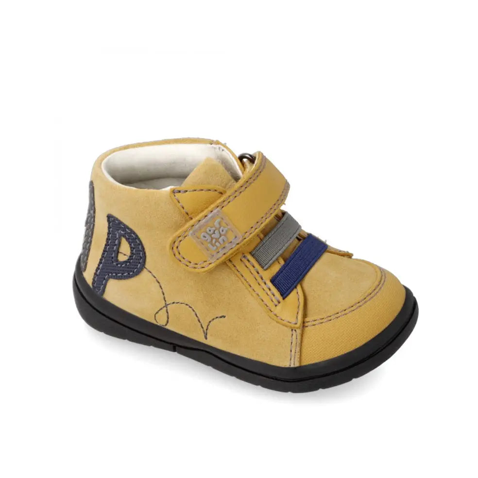 Garvalin Leather Booties for toddlers in yellow, navy embroidery, Velcro straps securing the ankle.