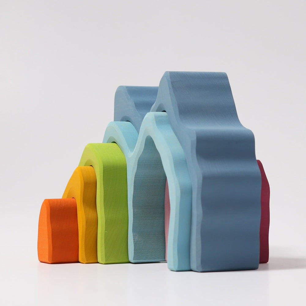 Grimm's Cave Arch Stacker 7pc wooden rainbow arches in orange, yellow, green, blue shades