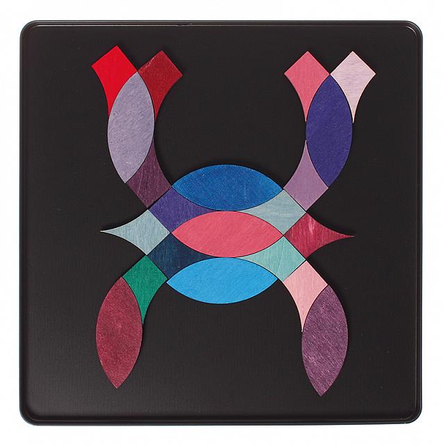 Grimm's Magnetic Puzzle: colorful geometric pieces on a black surface