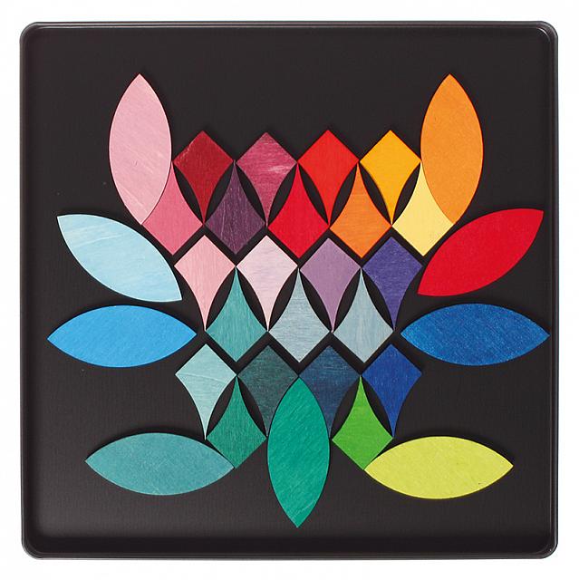 Grimm's Magnetic Puzzle with multicolor geometric leaf design on black background