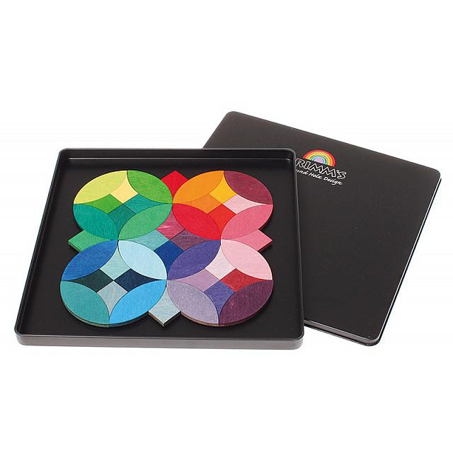 Grimm's Magnetic Puzzle set in a black tin with vibrant multicolor circular pieces