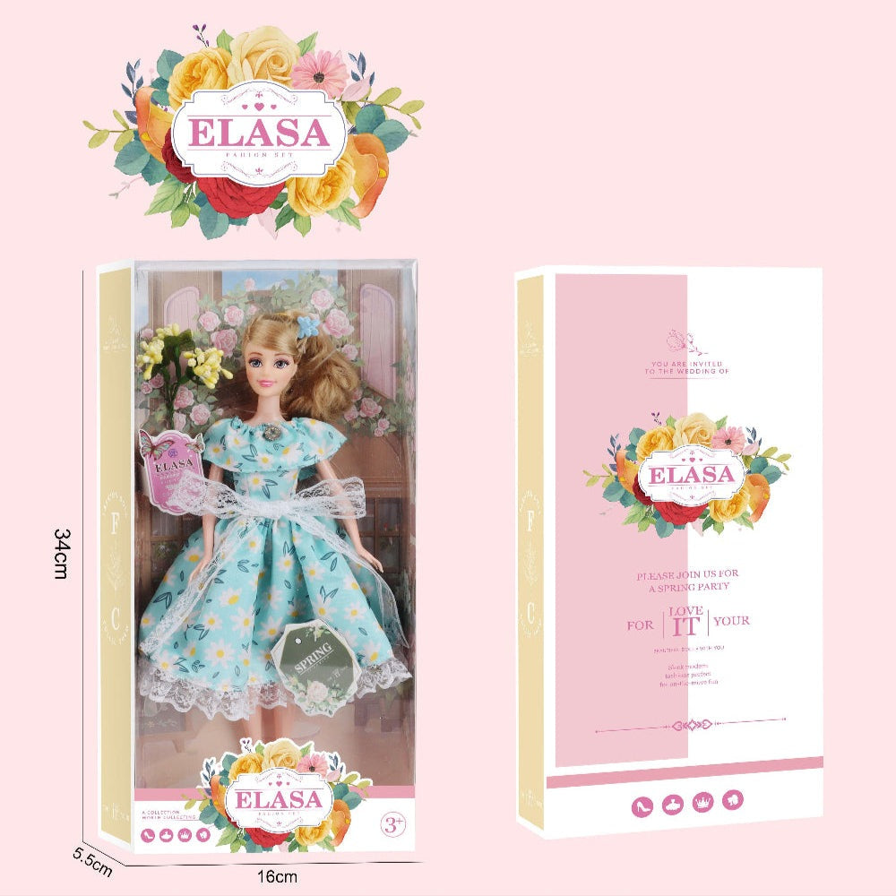 Elasa 11-inch doll in window box wearing a blue floral dress with lace sash