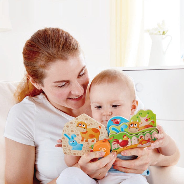 Hape Baby's Farm Animal Book, a wooden baby toy; mother and baby hold and explore colorful farm animals.