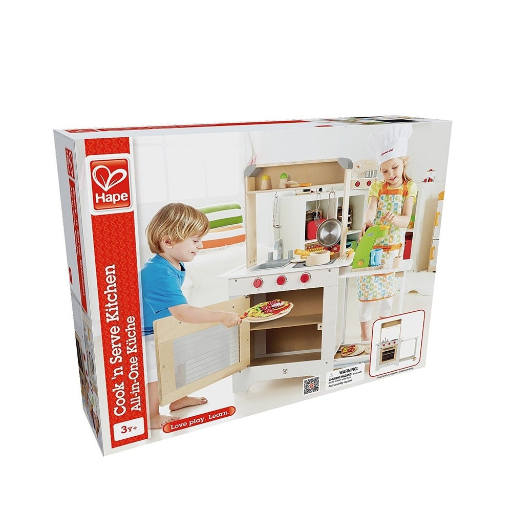 Hape Cook N Serve Kitchen wooden toy set with red knobs; kids cook and serve pizza in a bright playroom.
