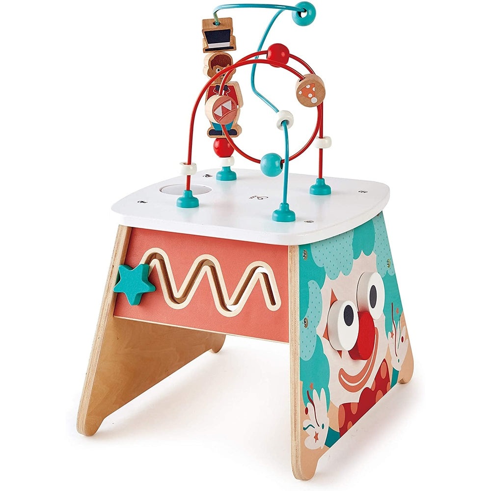 Hape Light Up Circus Activity Cube; wooden bead maze on a white top with teal accents and clown panels