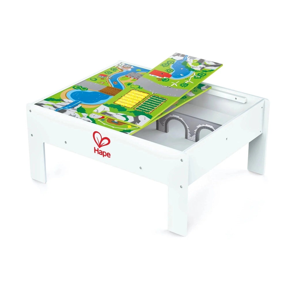Hape Reversible Train & Storage Table white wooden play table with colorful train track on top and storage underneath.