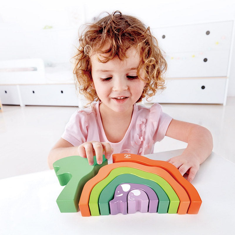 Hape Safari Elephant Stack Blocks; rainbow-colored wooden arches stacked by a toddler.