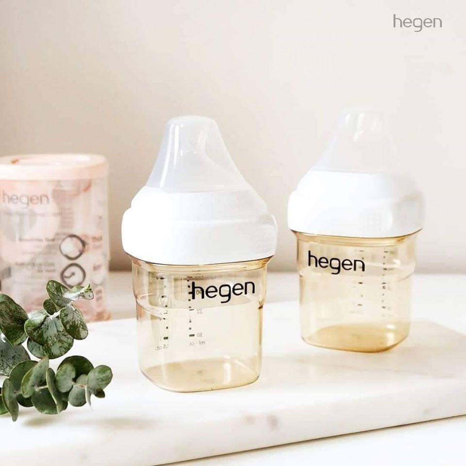 Hegen PPSU baby bottles in 5oz and 8oz sizes with square-shaped bodies and press-to-close lids on a marble surface