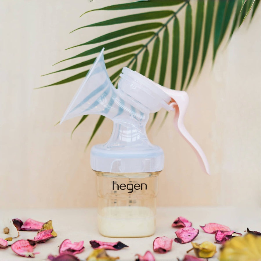HEGEN PCTO manual breast pump with clear bottle and white and pink lever