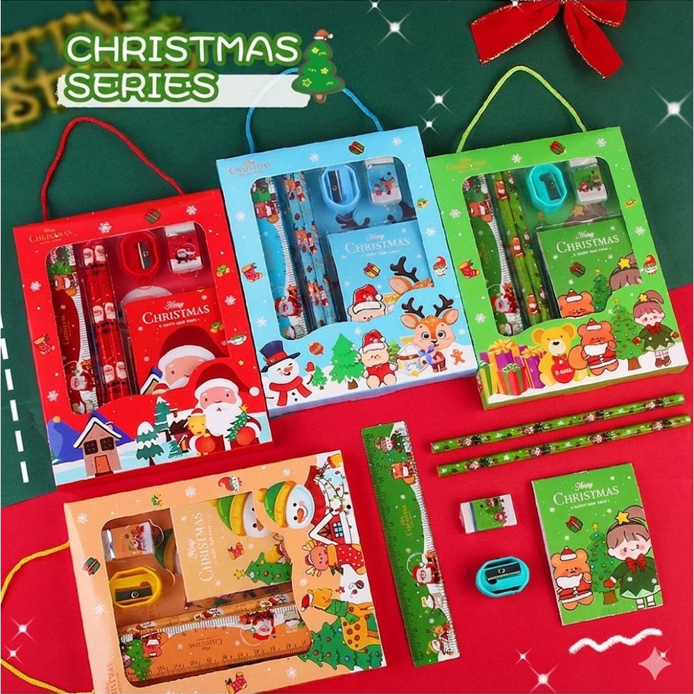 Holiday Joy Kids Stationery Gift Pack by Baby enRoute; three festive gift boxes open to reveal pencils, rulers and erasers.