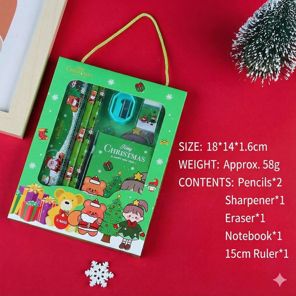 Holiday Joy Kids Stationery Gift Pack in a green box, showing pencils, notebook, sharpener, eraser and 15cm ruler.