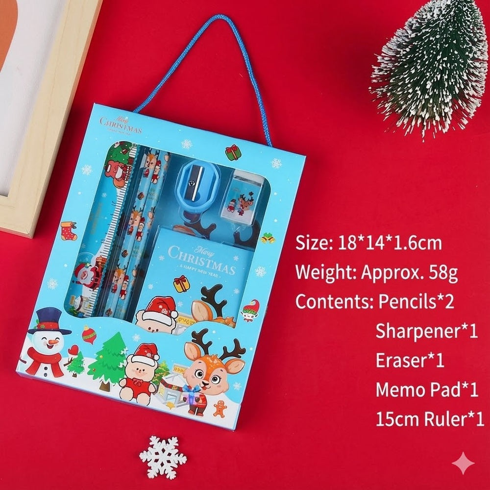 Holiday Joy Kids Stationery Gift Pack in blue gift bag with handle, showing pencils, sharpener, eraser, memo pad, 15cm ruler.