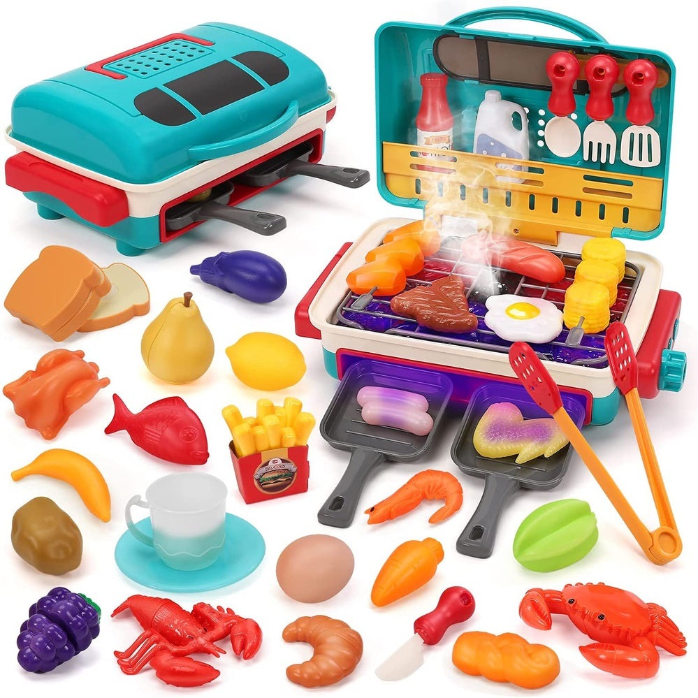 Holy Fun Kids grill playset with teal and red grill, 2 pans, utensils, and assorted toy foods.