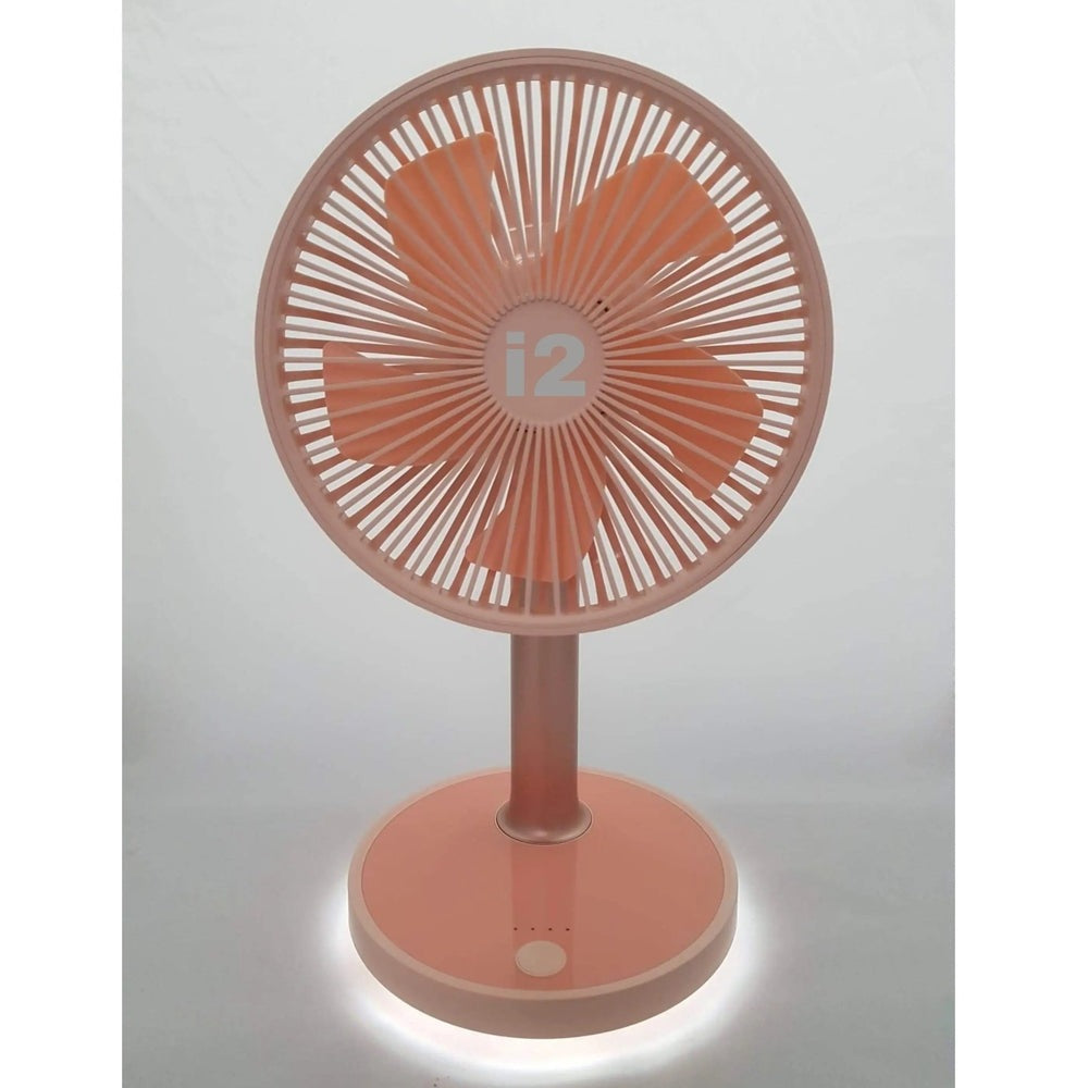 I2 Desktop 4-Speed Lithium Fan With Nightlight in pink; a compact pink desk fan glows softly from the base.