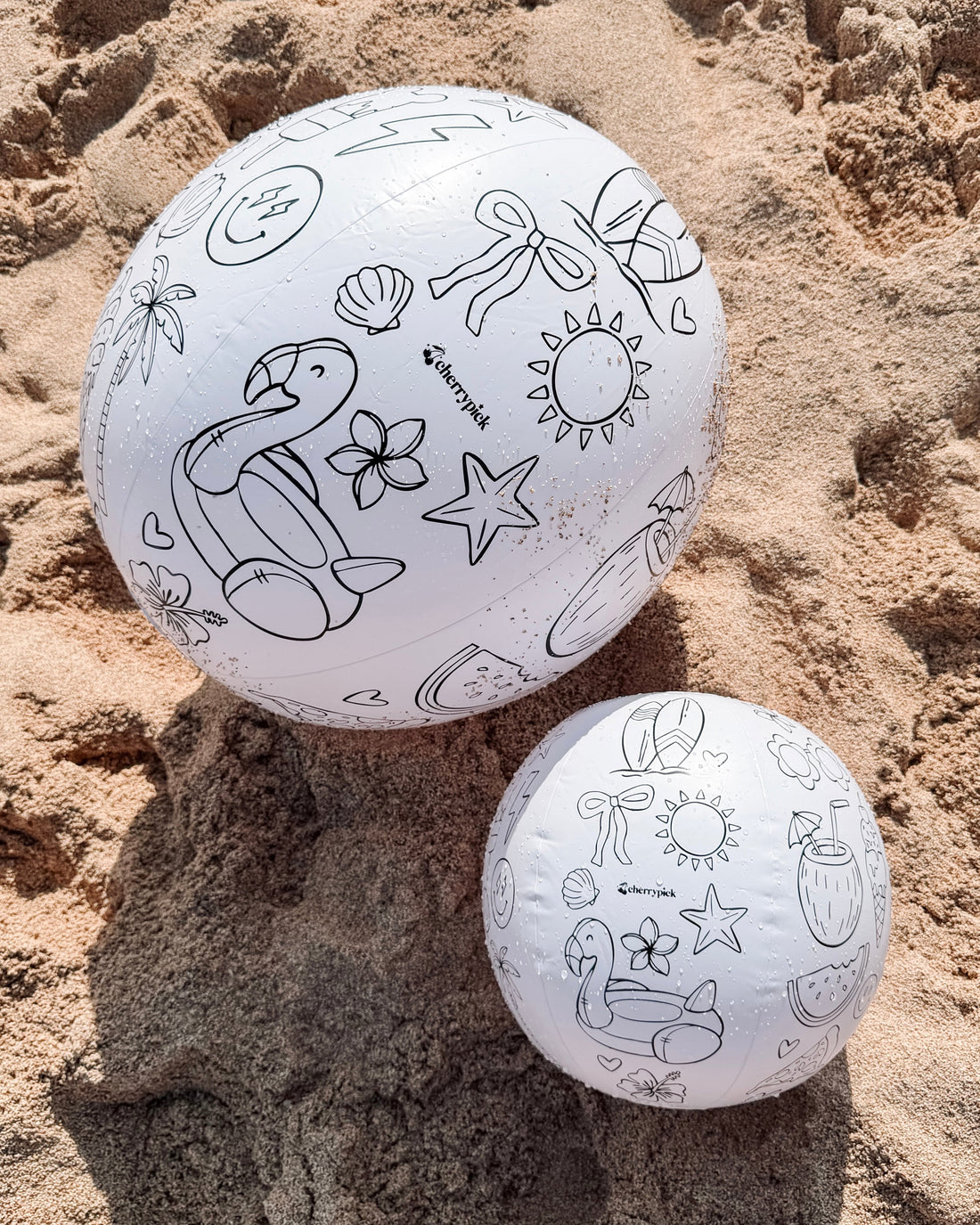 Cherrypick Design Your Own Beach Ball Kit uncoloured balls on sand