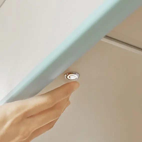 Iloom Cabin Bunk Bed stair-type with lighting; a hand taps the built-in LED under the stair.