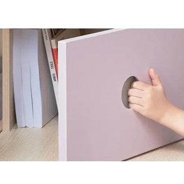 Iloom Cabin Bunk Bed with stairs in lavender, where a child uses the circular hand hole to open the panel.