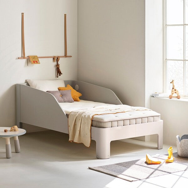 ILOOM Coco Kids Spring Mattress 1000W on a light gray kid's bed with a cream throw