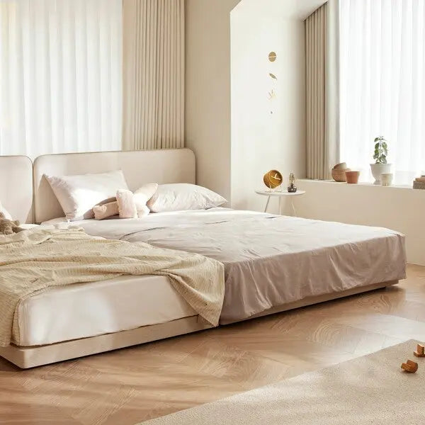 ILoom Cusino Low Floor Bed K Size in beige fabric with a draped blanket on a low platform bed in a bright, cozy nursery.
