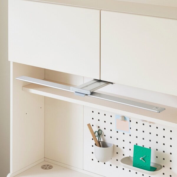 Iloom desk lamp, angle adjustable, mounted under a white cabinet with a metal track