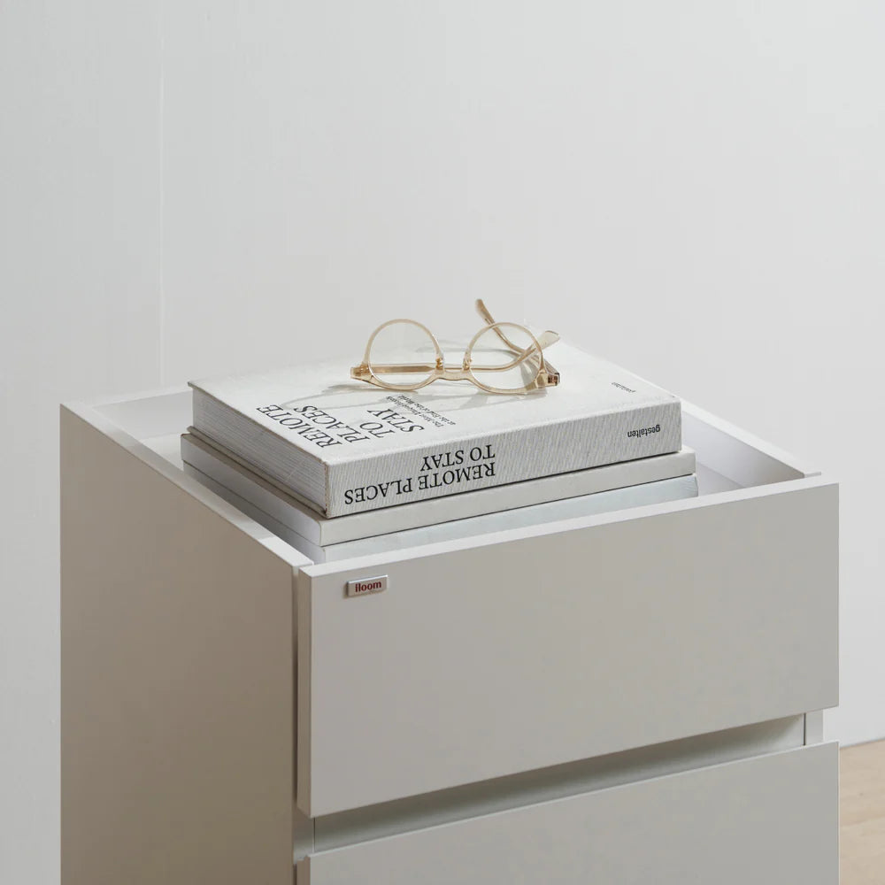 Iloom Roy Mono desk drawer in white with two books and gold-rimmed glasses on top
